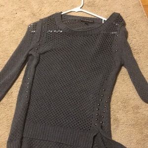 Gray studded knit sweater.